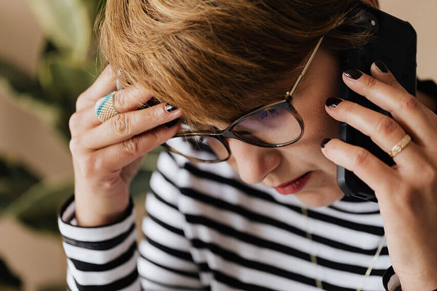 woman on phone frustrated